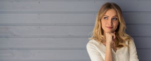 Woman thinking about how to lower her credit card interest rate