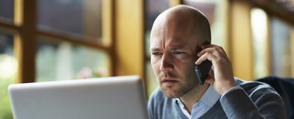 Man looking at a derogatory mark on his credit reports