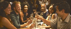 Group of friends enjoying meal in a restaurant