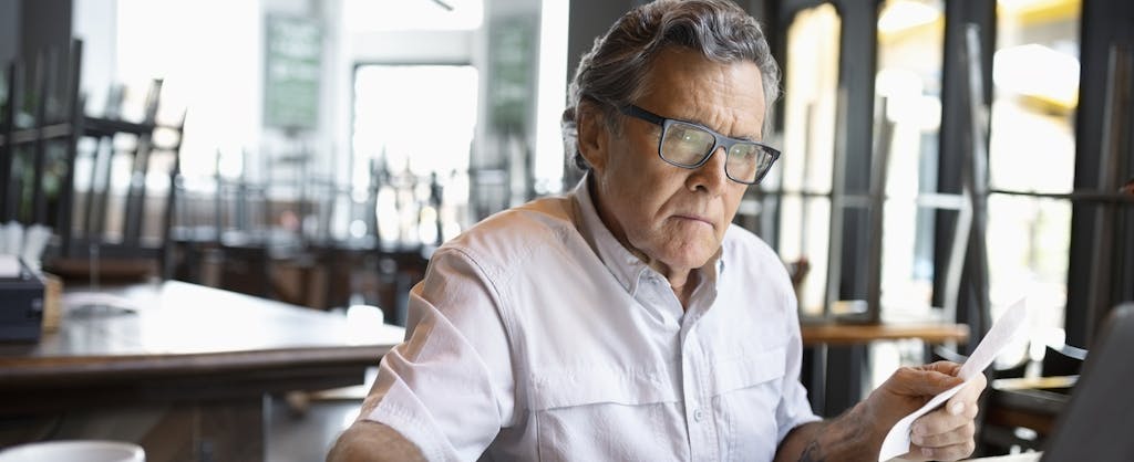 A man with gray hair researches how to freeze your credit
