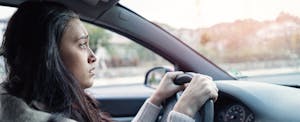 can-i-return-a-car Concerned woman driving her car