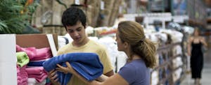 Woman and son shopping at Costco, making the most of the Costco credit card benefits