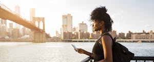 Young woman on vacation in New York, making the most of her JetBlue Mosaic credit card rewards