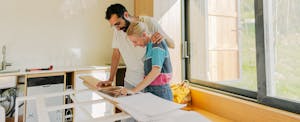 A couple reviews plans for home improvements they're making using a TD Bank HELOC.