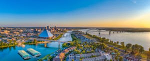 Aerial view of the downtown Memphis Tennessee skyline with the Wolf River harbor and the Hernando de Soto Bridge in the foreground.