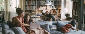 car-home-insurance-bundling Family sitting together in their living room